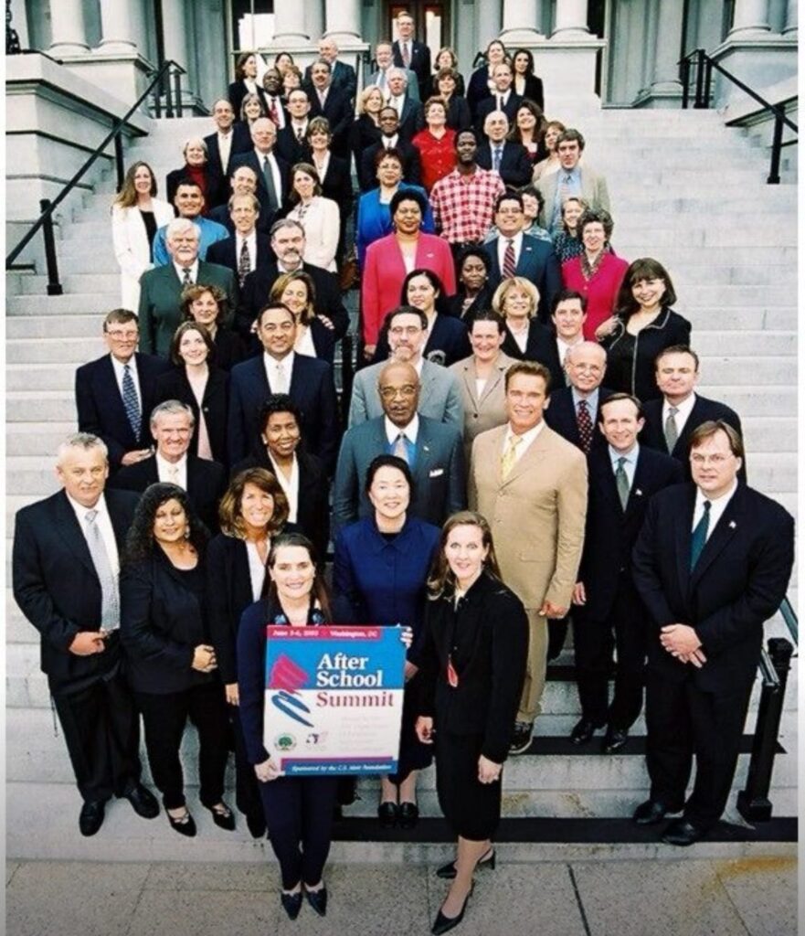 Large group portrait at a formal event.