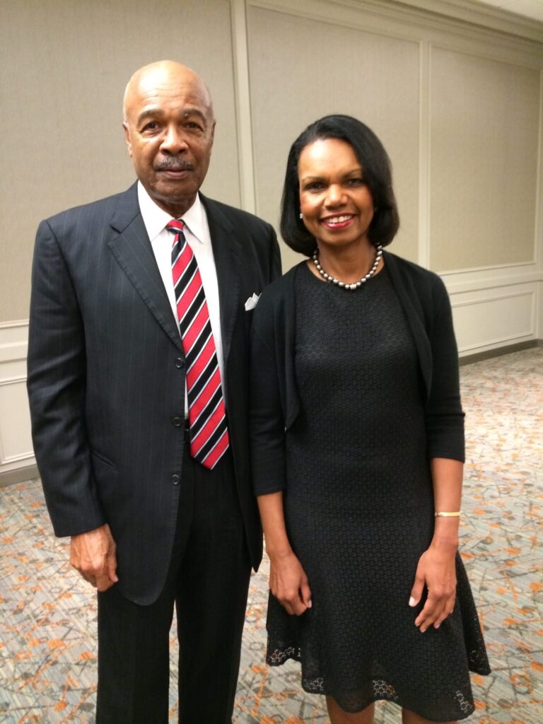 Dr. Paige with a woman, both in formal attire.