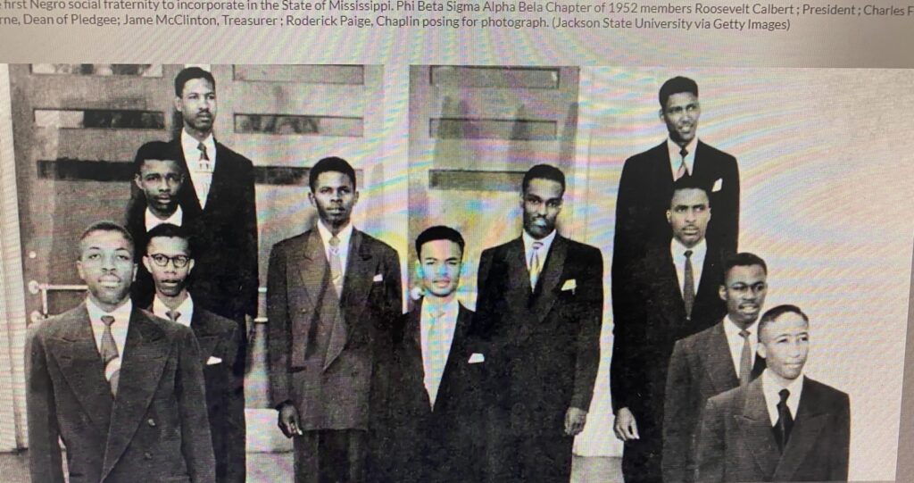 Black-and-white group portrait of men in suits.
