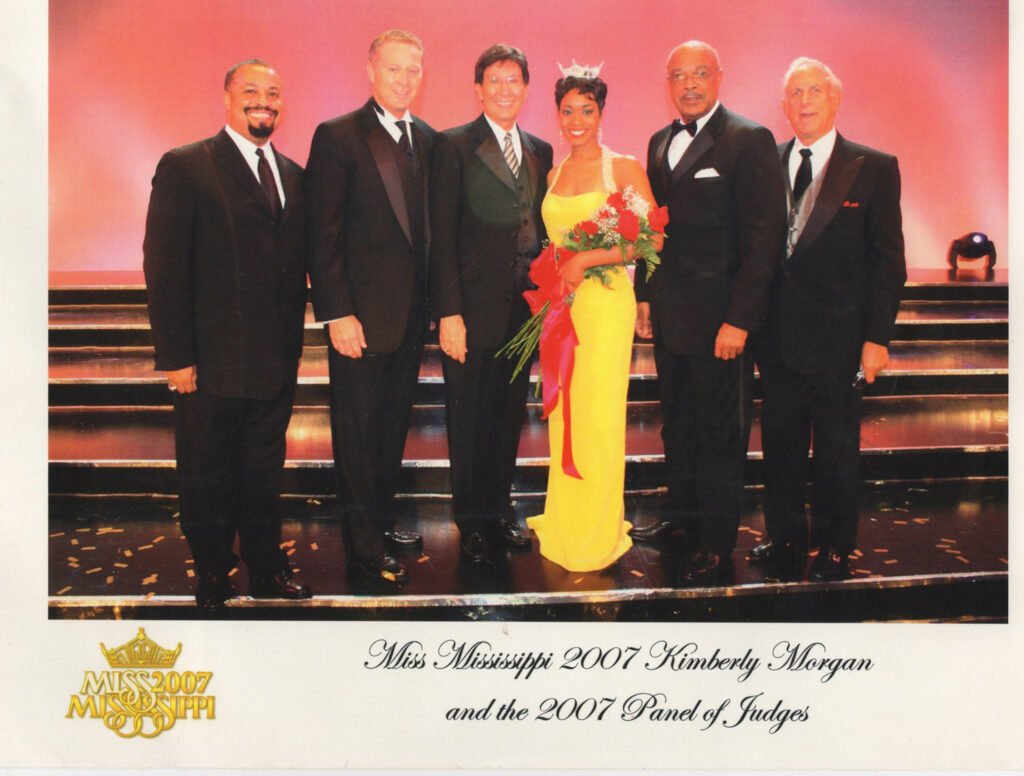 Group of men in suits at a 2007 awards ceremony.